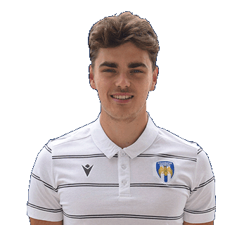 Image of a man wearing a Colchester United polo shirt